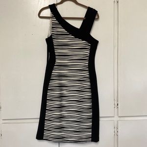 Asymmetrical shoulder detail of this fashionable Joseph Ribkoff dress.